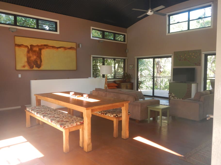 Open family & dining opening off to forest view deck