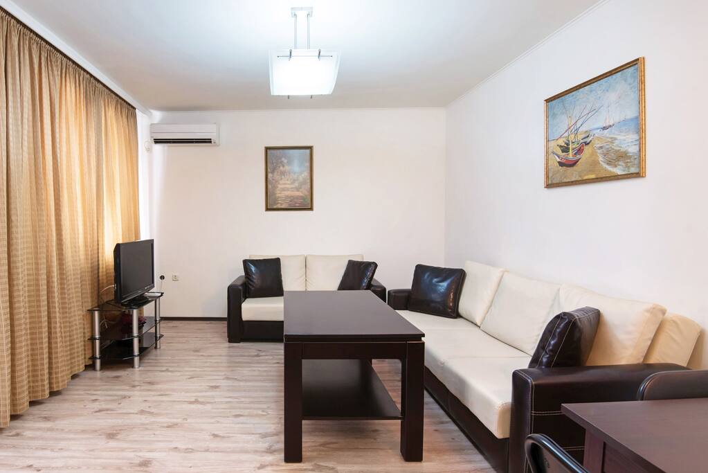 Sunny, spacious, and modern living room with new furniture