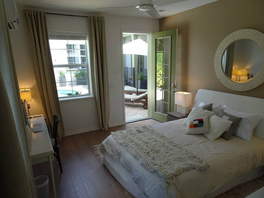 Master bedroom and view to pool/porch