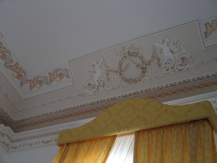 ceiling decorated with cherubs and grounds florals