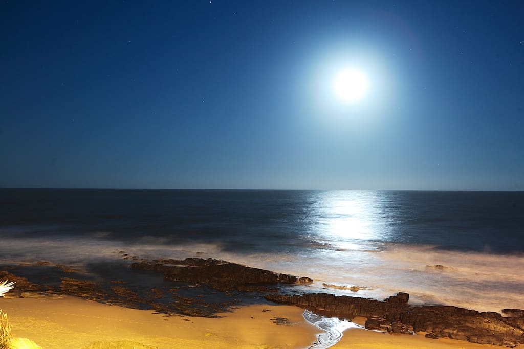 Watch the full moon come up over the ocean.