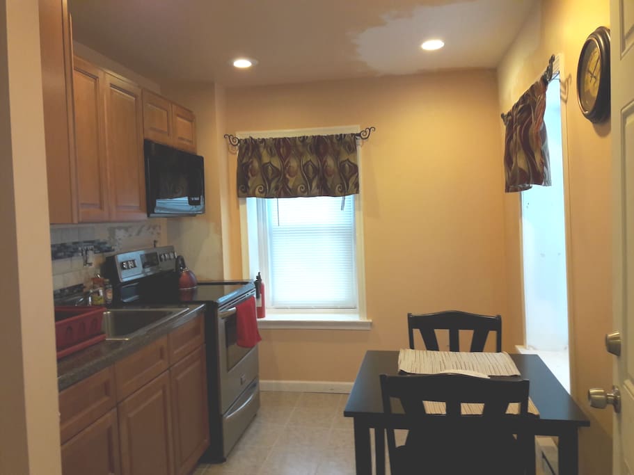 Kitchen with stove and microwave