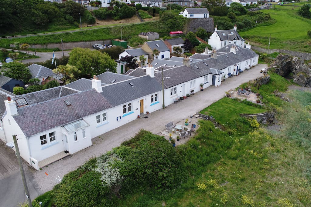 The cottage is 2nd from left in this row of 6.