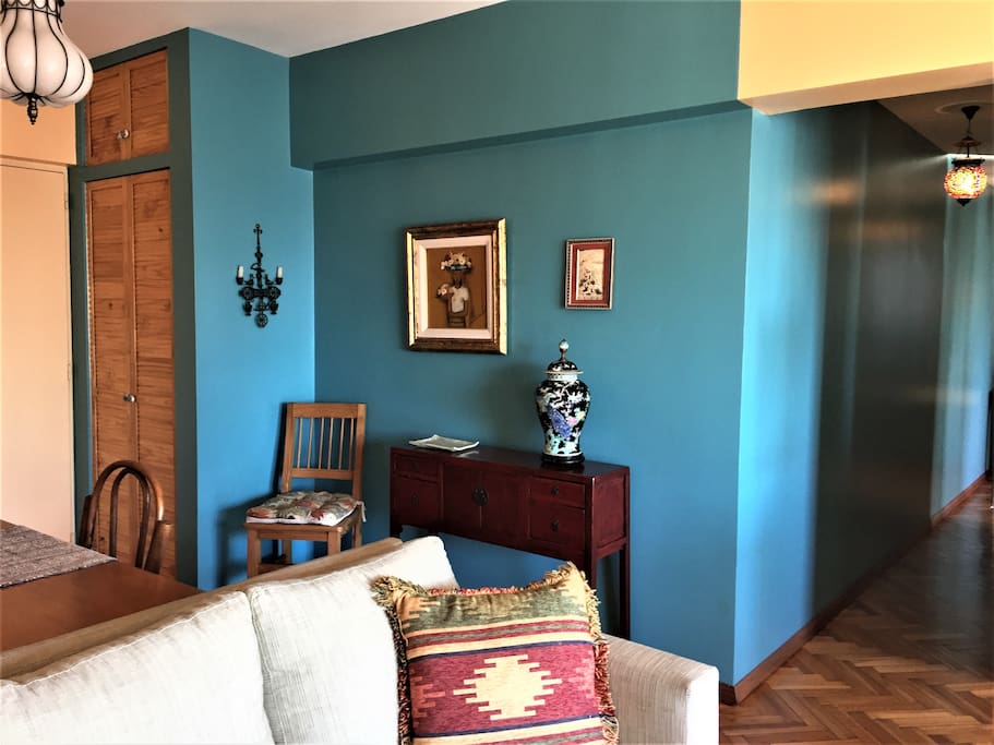Coat closet at the entry door. Striking color offsets Chinese, Uruguayan, Persian and Greek art.