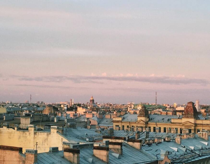 Just step on a chair, and you'll be able to see a broach of Petropavlovskaya fortress (you can even hear the midday salvo), a dome of Saint Isaac's cathedral, the mosque and a beautiful panorama of Saint Petersburg's roofs.
Our roof is a perfect spot to watch the fireworks.
Наш вид: Стоит только встать на стул — и можно любоваться на шпиль Петропавловской крепости (слышно даже полуденный выстрел пушки!), купол Исаакиевского собора, телебашню, макушку мечети, самый большой небоскреб Европы Охта и бесконечные козырьки петербургских крыш. Отлично будет видно и салюты — мы, русские, большие их любители.