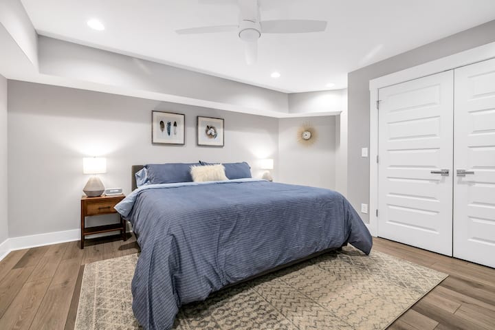 Sink into the luxurious embrace of our king-sized bed, wrapped in crisp blue linens, ensuring a night of serene slumber. The bedroom harmonizes comfort with elegance, offering a tranquil haven for rest and rejuvenation