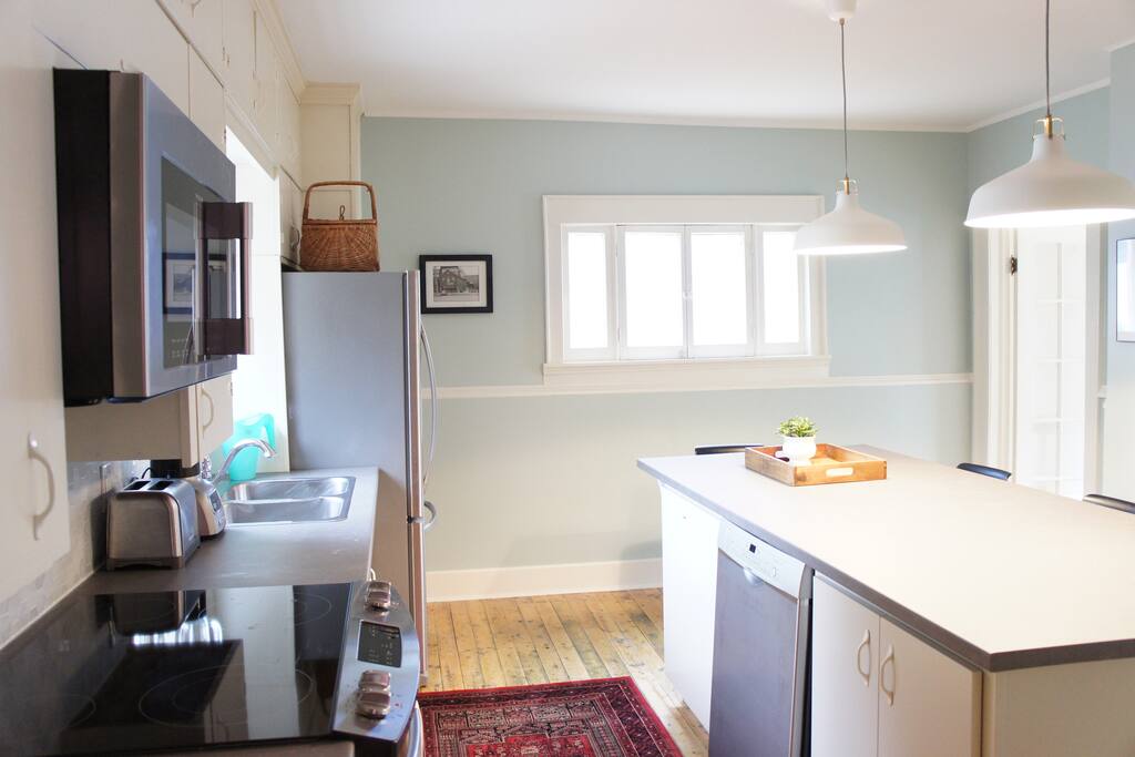 Large sunny kitchen with custom kitchen island