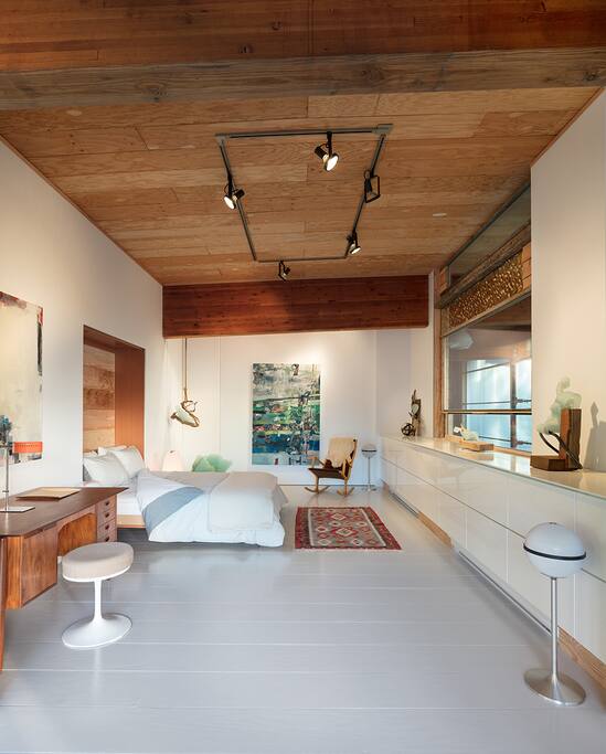 Wake up in a comfortable queen sized bed. A large studio window allows the morning light to spill in.