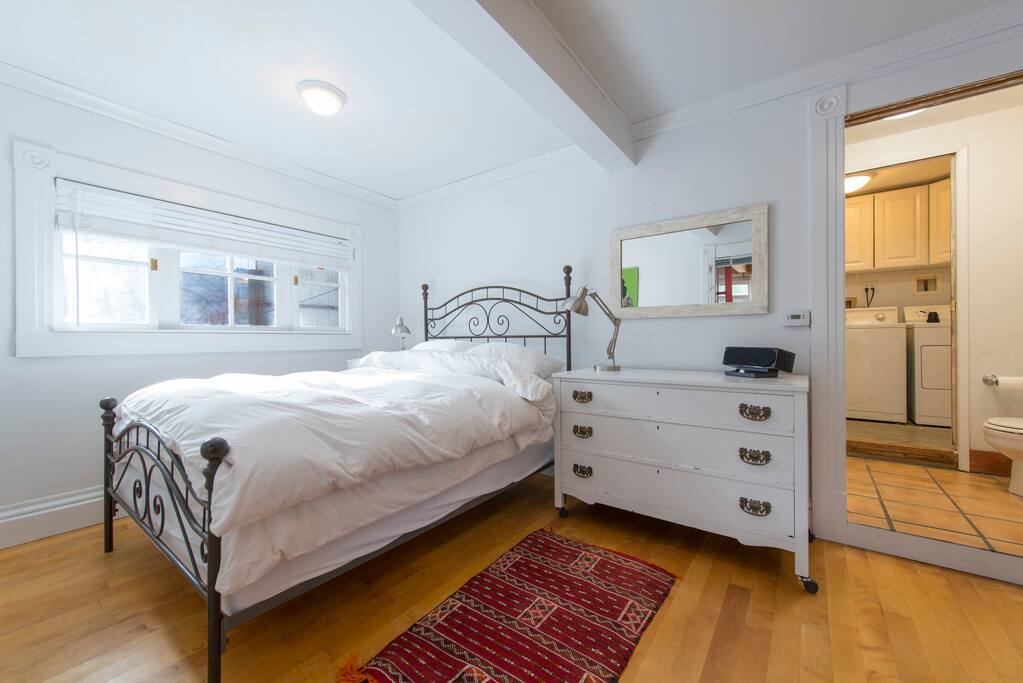 View from bedroom into bathroom and laundry room.