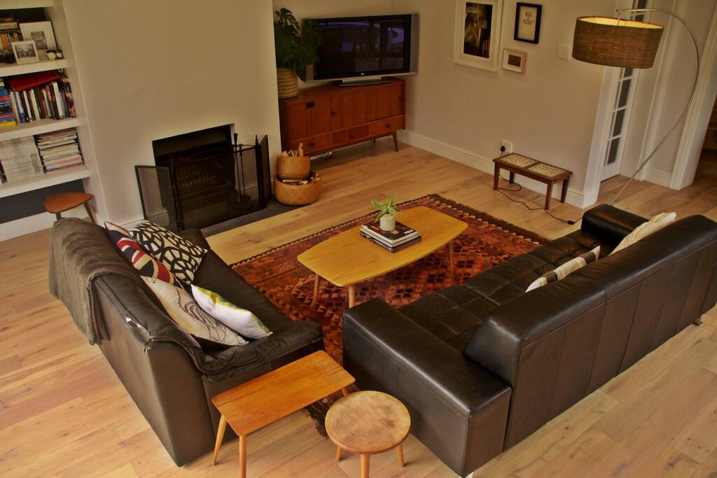 Living room with TV and fireplace