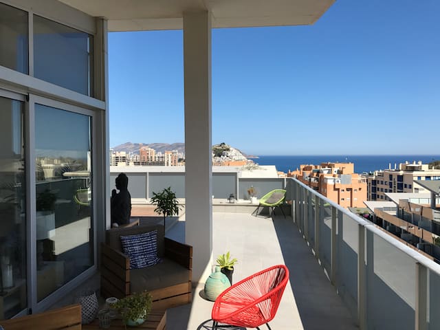 Room in sunny penthouse by the sea