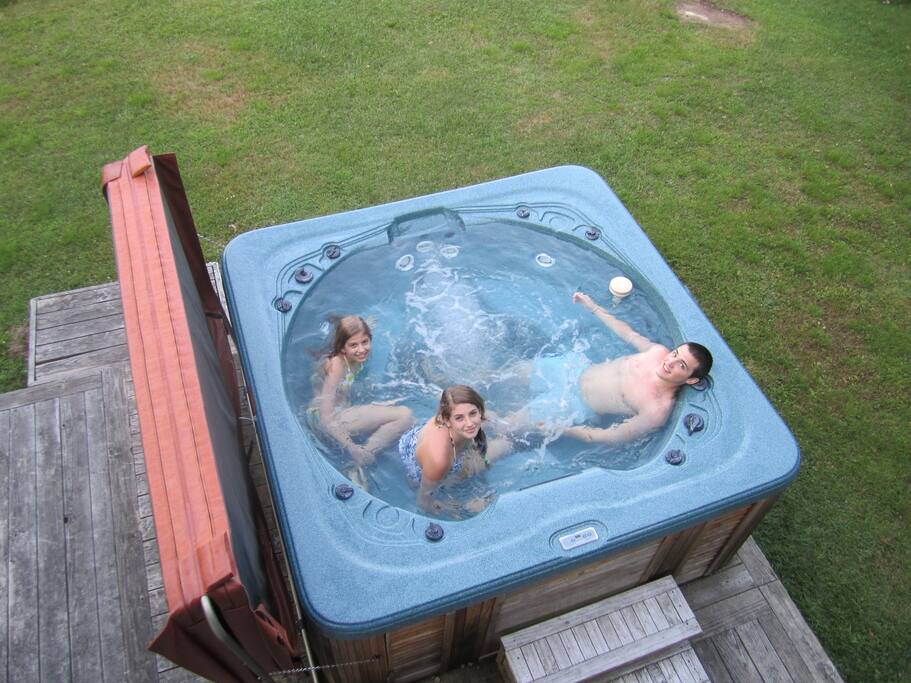 Private hot tub on the back deck with views of the lake