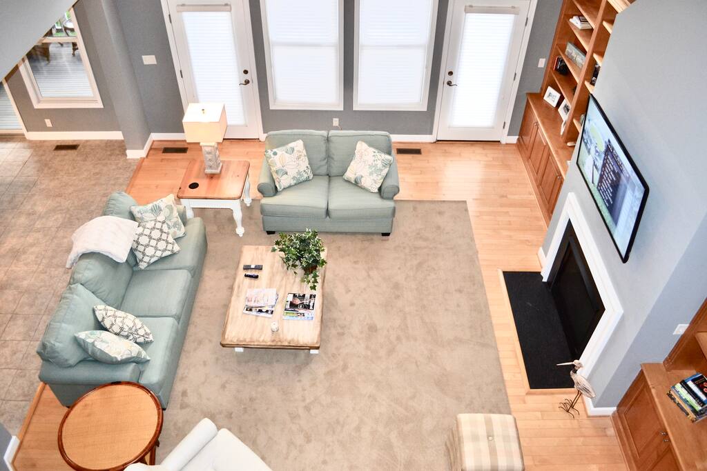 2 story family room with queen sleeper sofa, 55" Smart 4K flat screen with Xfinity cable & gas fireplace