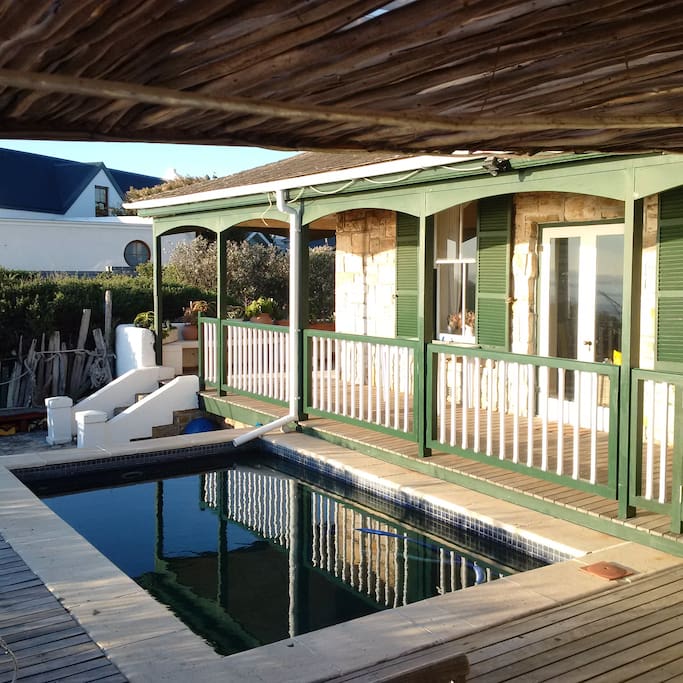 Large deck with plunge pool and covered stoep all around house.