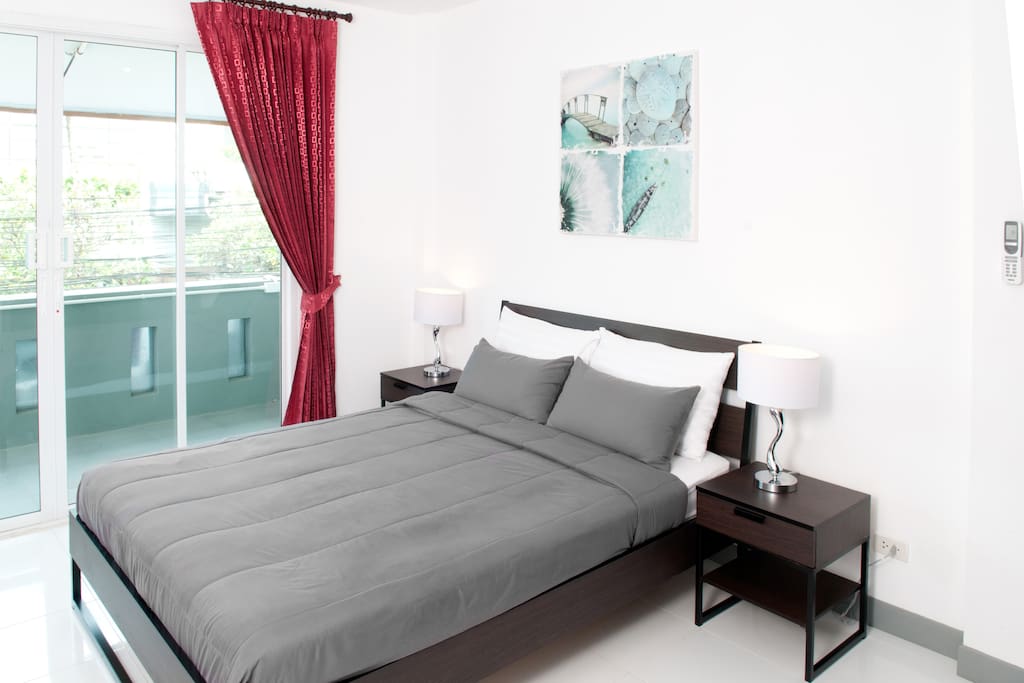 Close up of bed and bedside tables. Very comfortable mattress and soft cotton sheets.