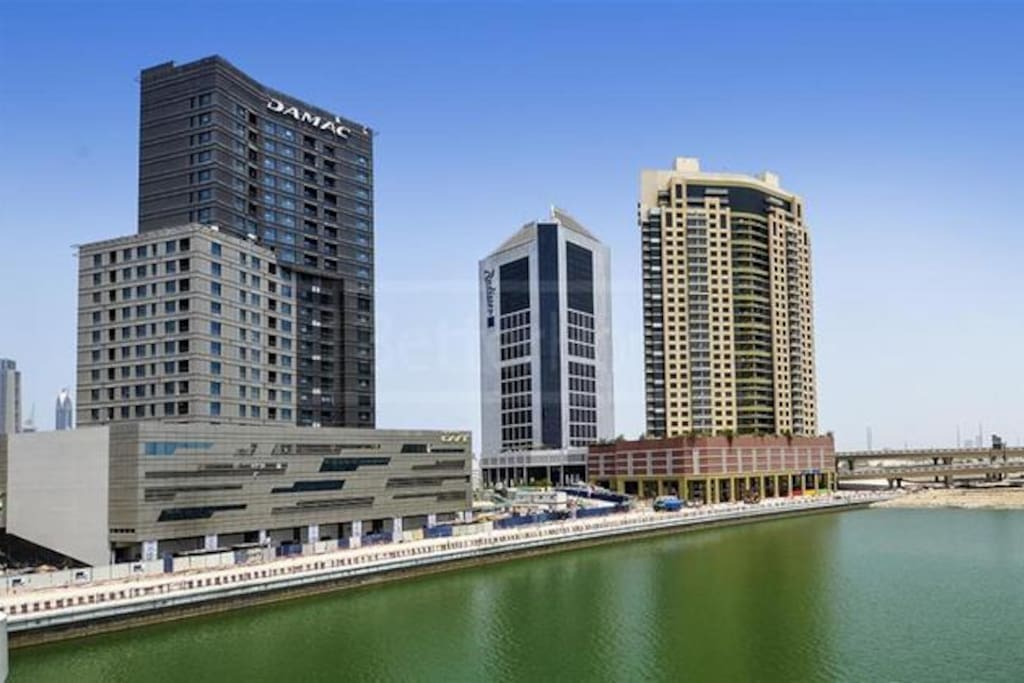 The studio is at the building of the left that says Damac and has full canal view