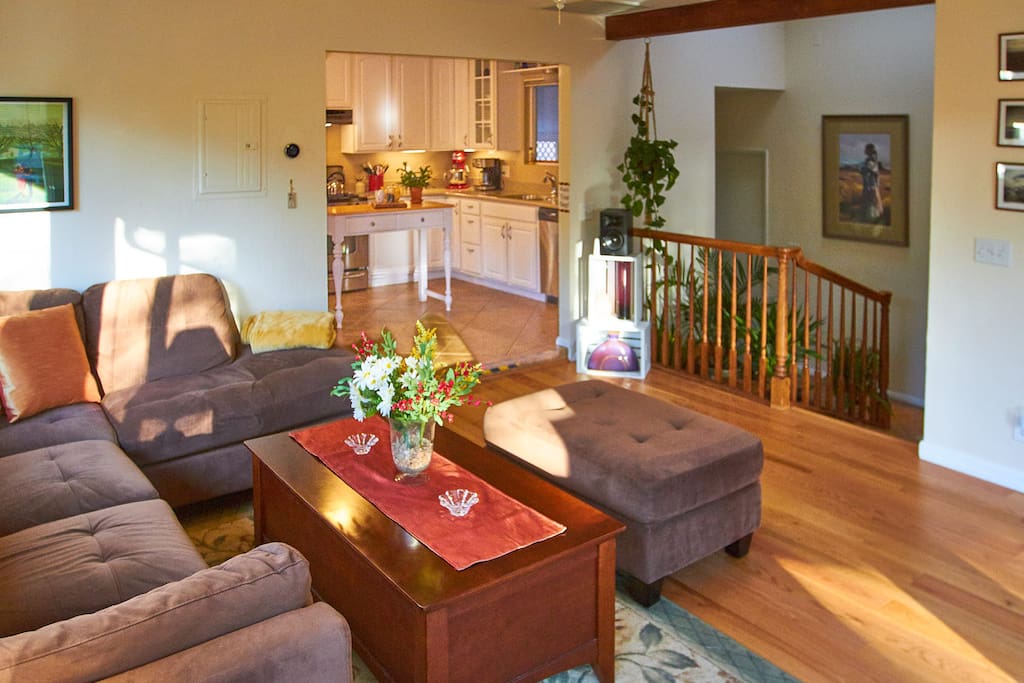 With the adjoining kitchen and atrium, the living room has an expansive feeling