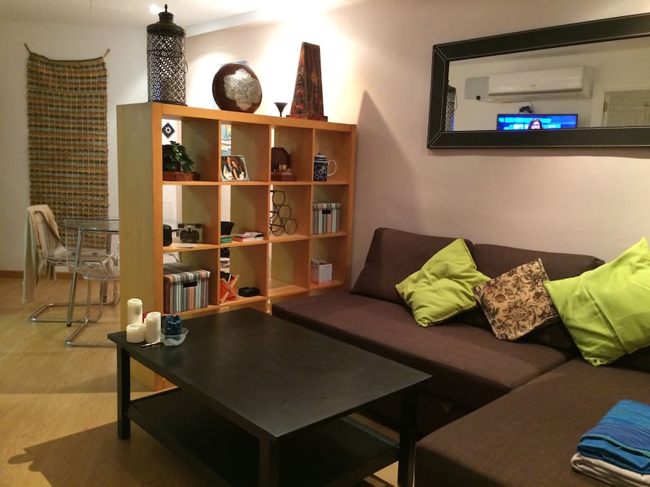 Split lounge and dining area, the sofa folds out to make a double bed.