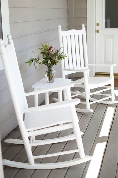 Enjoy a sunny afternoon on the front porch overlooking the Apple Farm.