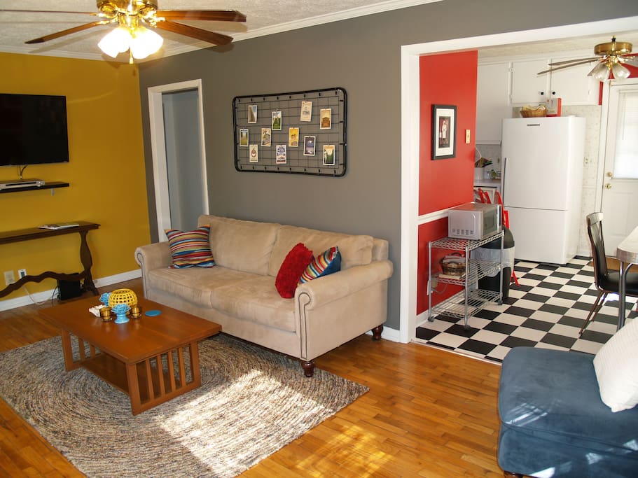 Living room opens to cool retro kitchen and dining area
