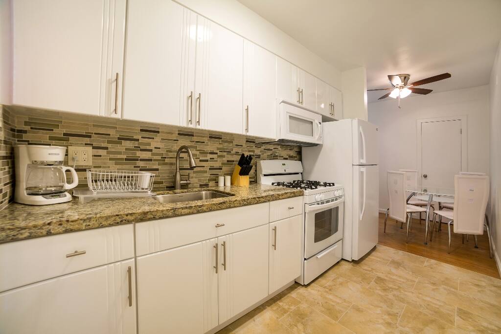 Kitchen with Oven, Refrigerator, Microwave, Plates, Silverware & Coffee maker with all the coffee & tea you can drink