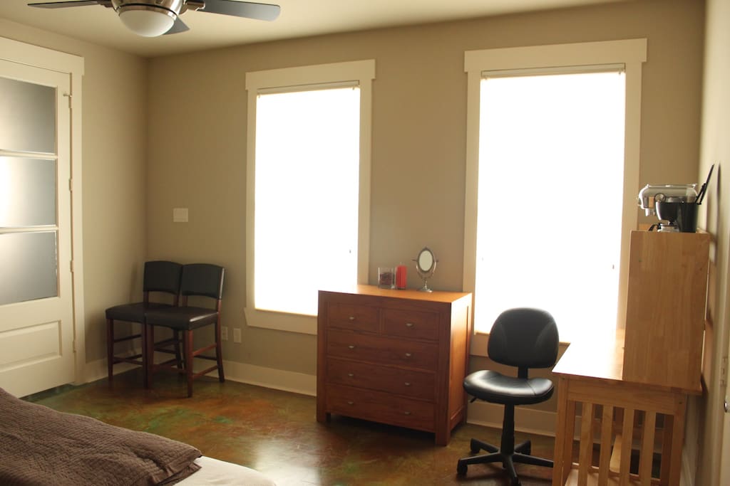 Dresser, desk, and coffee machine to make you feel a bit more at home.