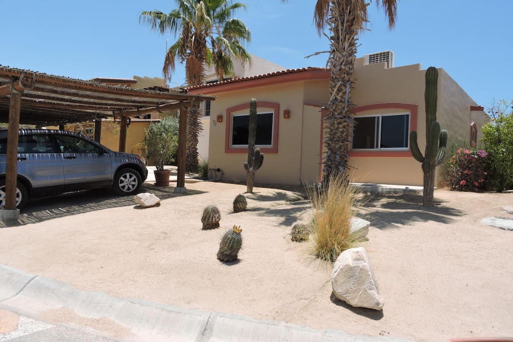 Front of the home has two covered parking spaces