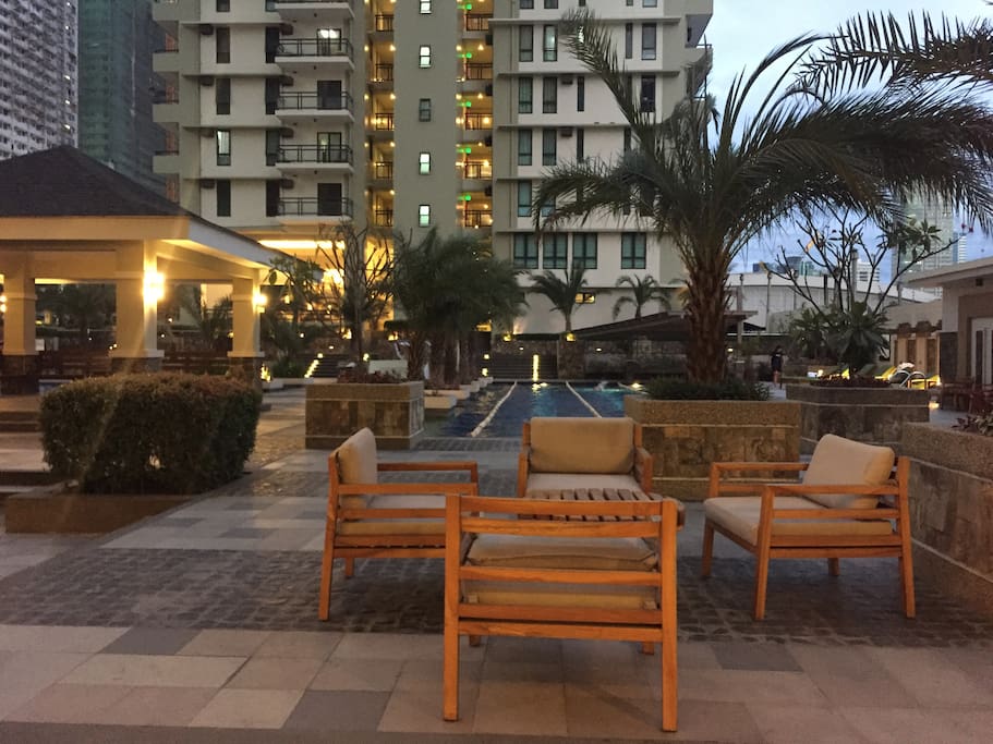 Plenty of tables by the pool area to lounge around and enjoy the resort-like ambience