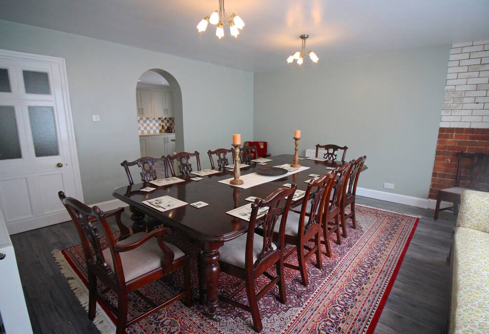 Our dining room has a 10 seater mahogany table. The exposed tiles show the history of the building and its previous life as the butchers shop for the village.