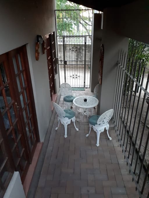 Entrance to own covered patio from private parking