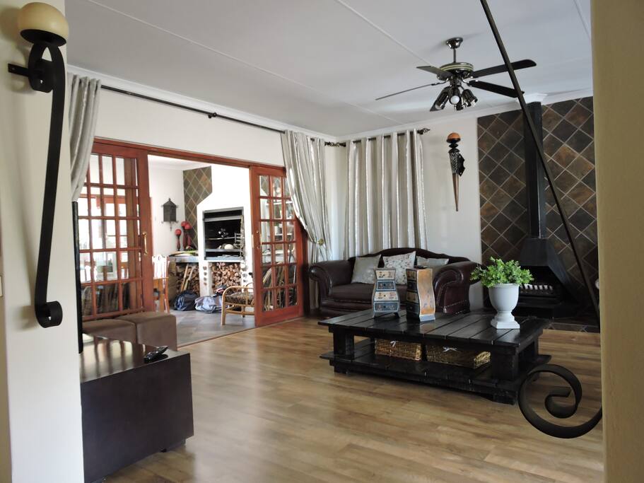 TV room with wood fireplace.