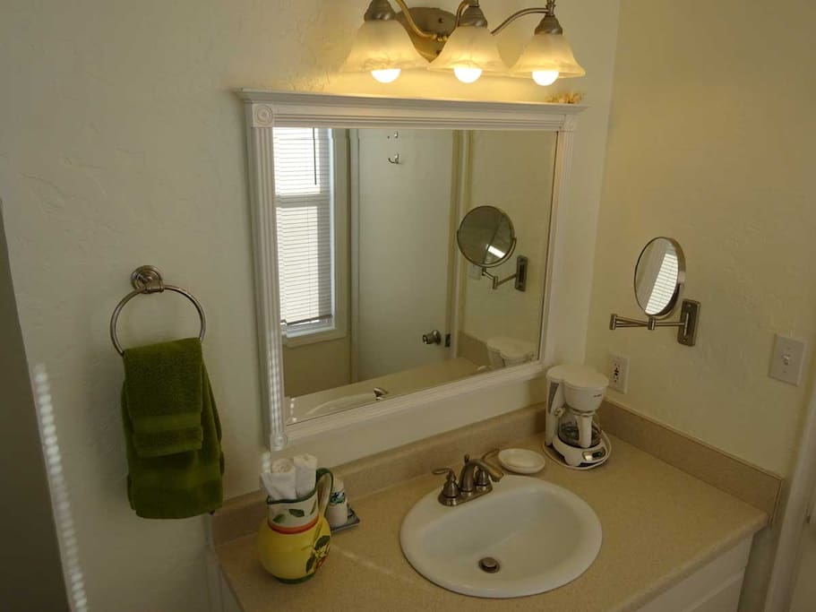 Bathroom vanity, hair dryer included.