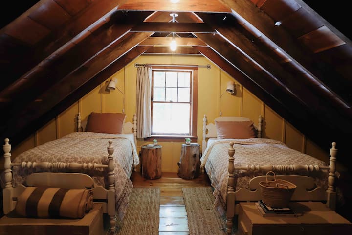Twin beds in attic style bedroom