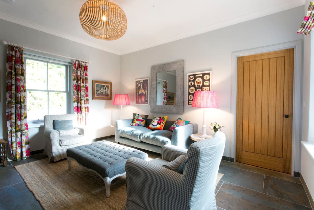 Cosy and cheerful sitting room with flat screen tv and wood burning stove. WiFi throughout the cottage.