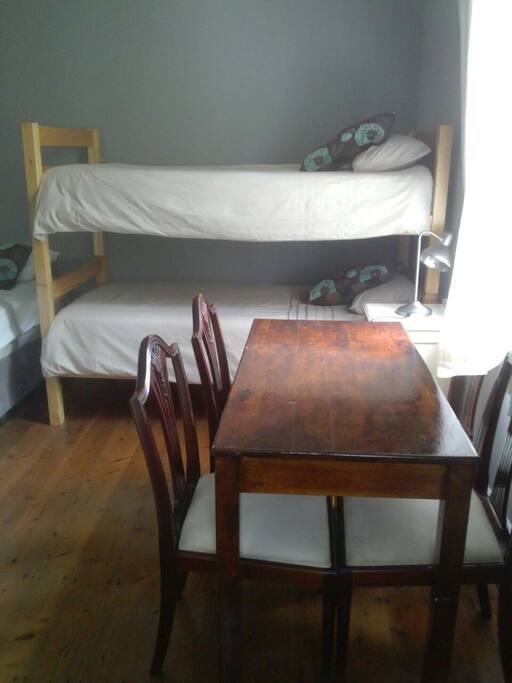 A table for 4 with plug access.