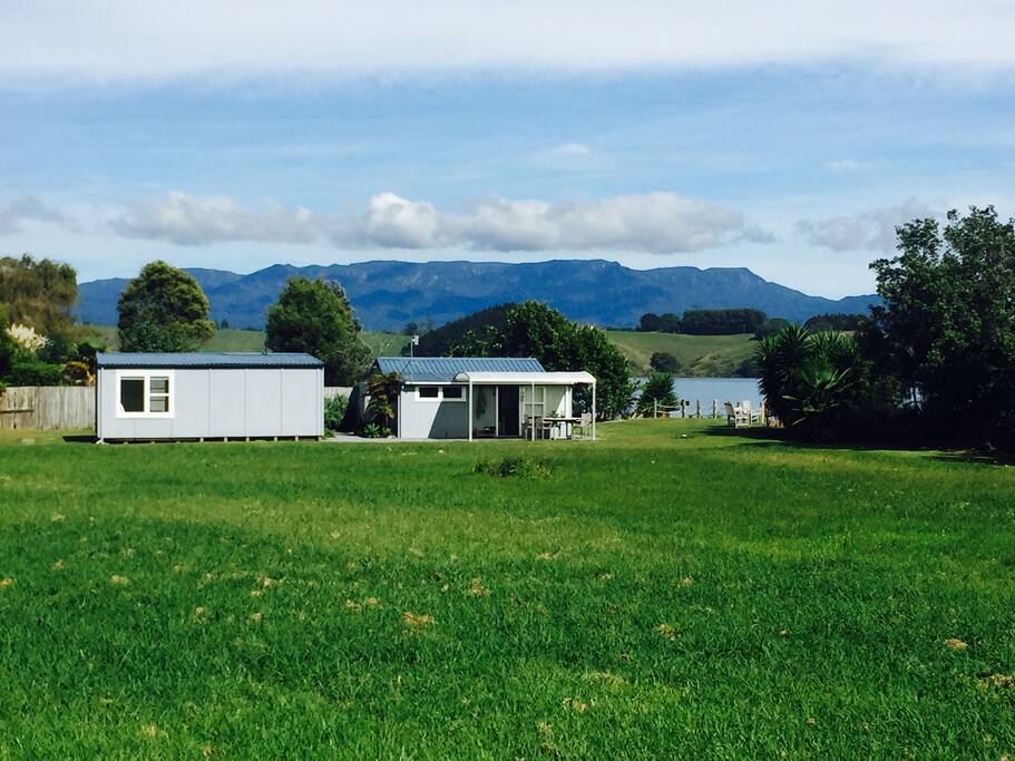 Main cottage has two kitchen, lounge and two bedrooms. Self contained room at back contains bathroom, shower and bedroom.