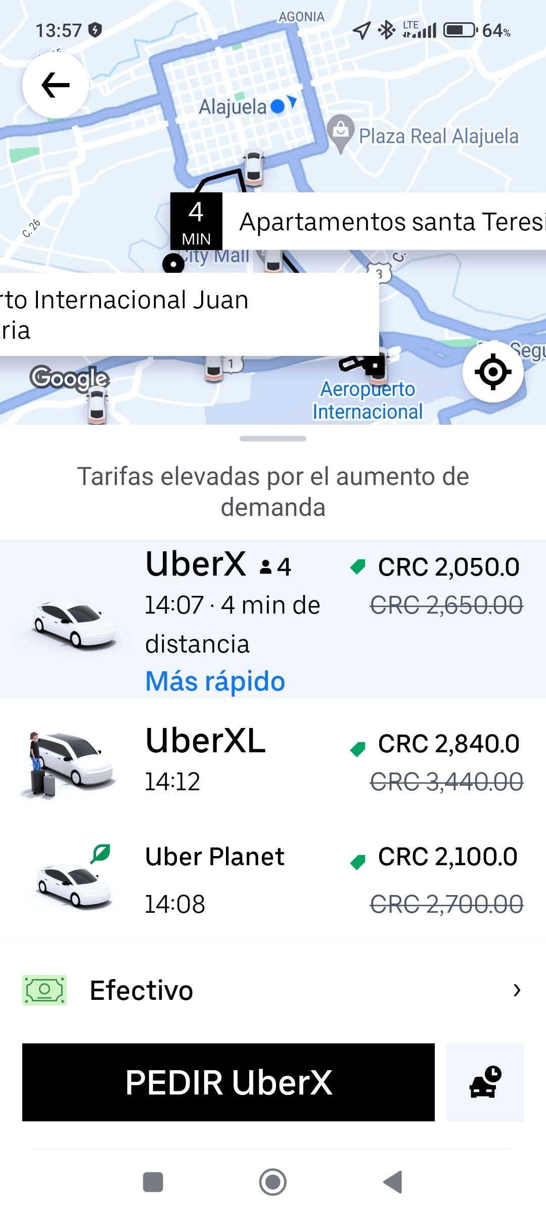 A smartphone screen displays the Uber app, showing available ride options in Alajuela. Distances and estimated fares for different services are listed, including UberX, UberXL, and Uber Planet, with travel times and prices noted for each option.