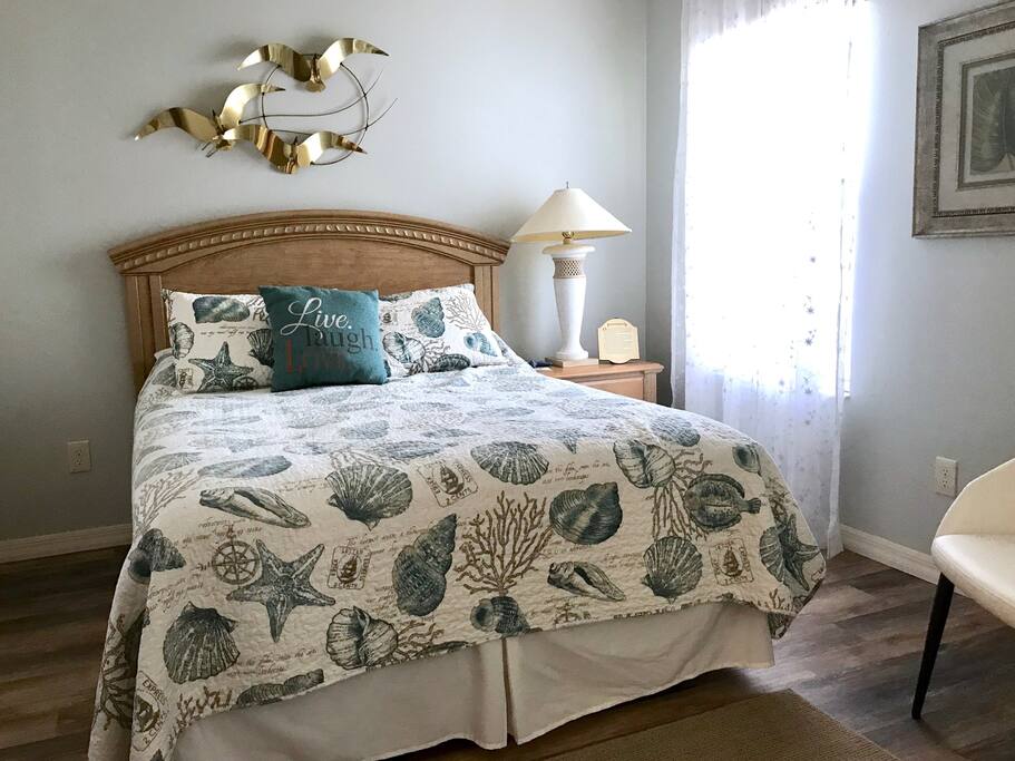 QUEEN bed and window.