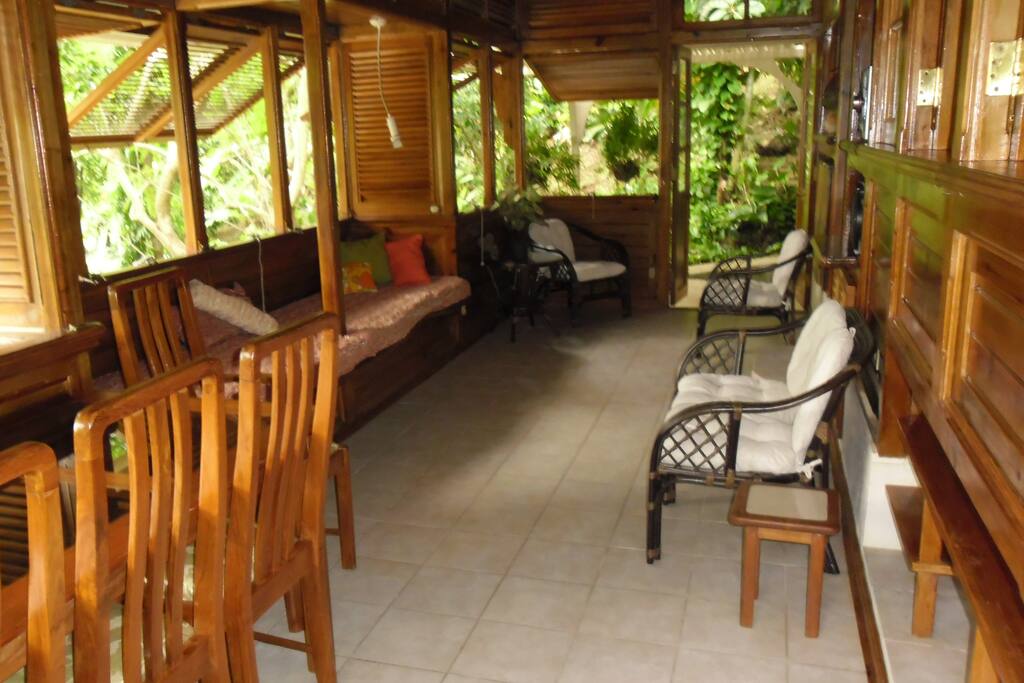 Living/Dining Space with windows overlooking garden