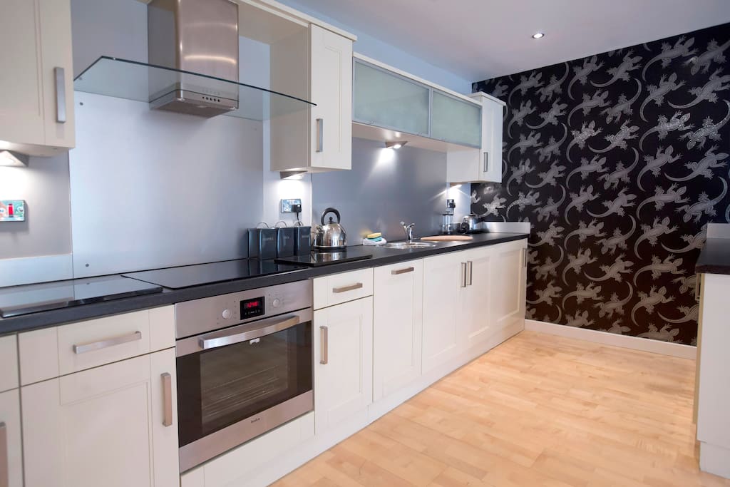 The spacious kitchen comes fully equipped with everything yo need for your stay