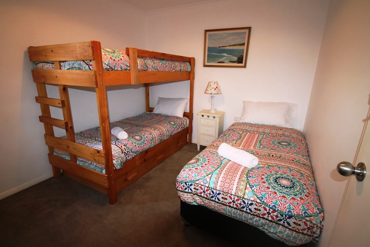 Bedroom 5 has a bunk & a single bed
