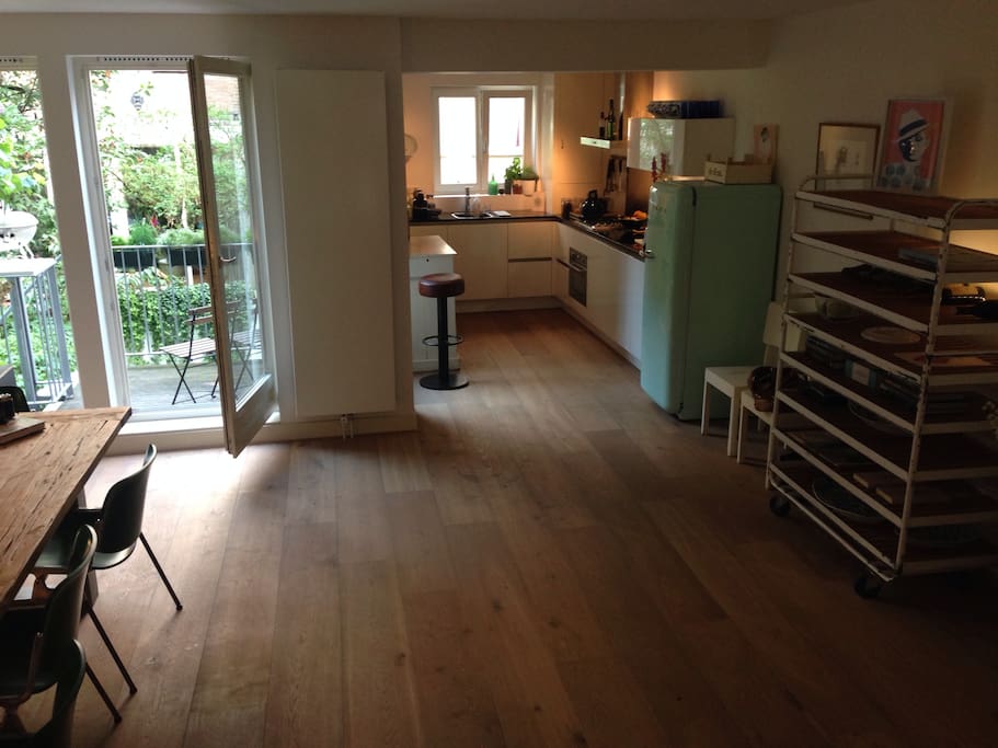 Dining area and kitchen with balcony (with access to garden via staircase)