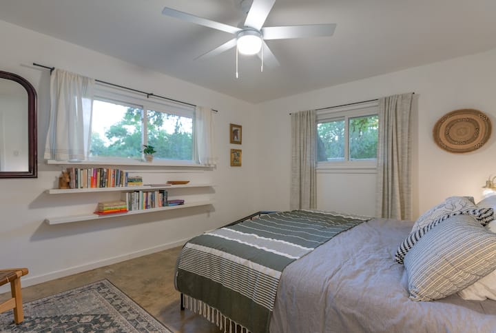 The master bedroom features a king bed and lovely natural light. 