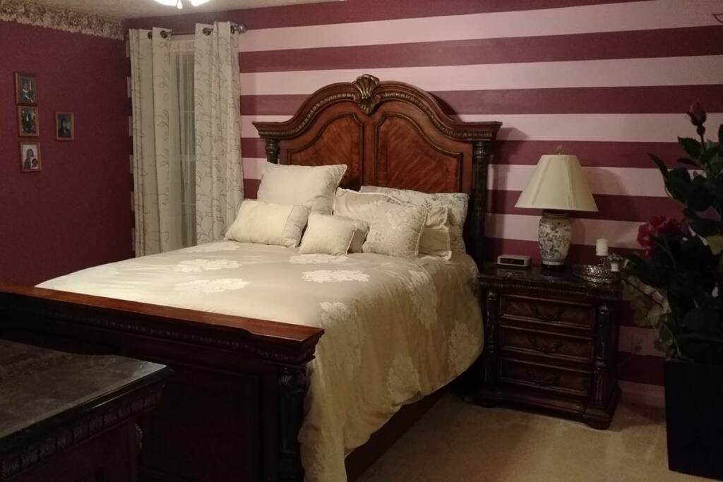 Master Suite with Queen Sized Bed, Private Bathroom with Shower and Garden Tub, Sitting Area, and Closet Area