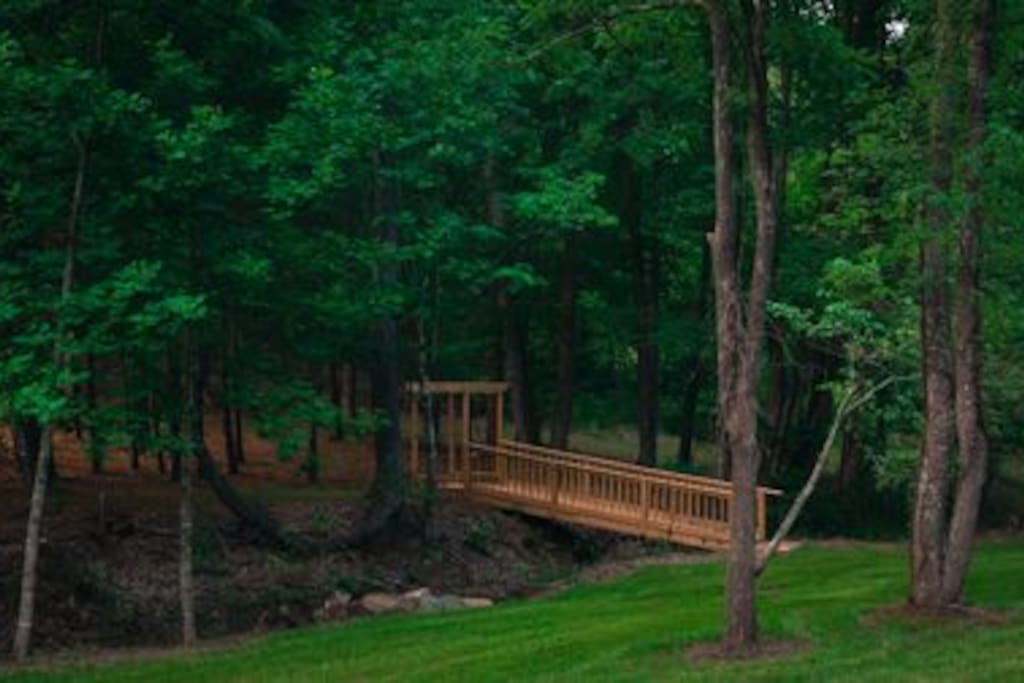 Enjoy walking by the stream and crossing our footbridge to an open field.