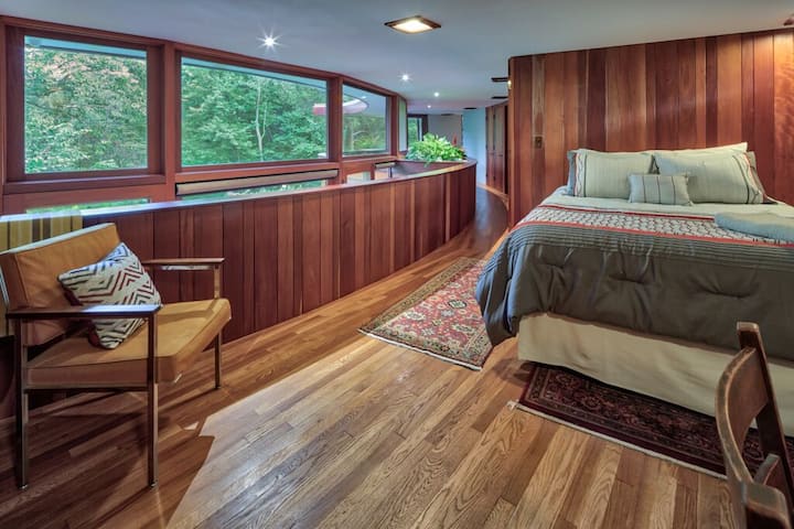 Master Bedroom, original oak flooring and restored tongue and groove Honduran Mahogany.  Photo Andrew Pielage