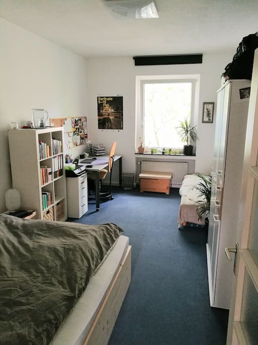 Your room including desk, pull-out couch and double bed