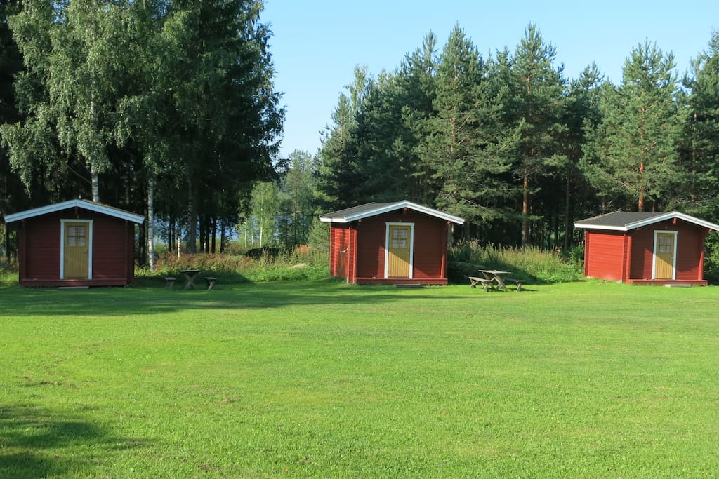 Three cottages (each of them for two people) right next to a lake on a beautiful farm.