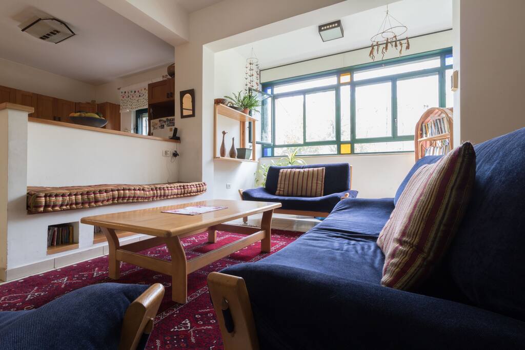 Living room with kitchen beyond the small wall