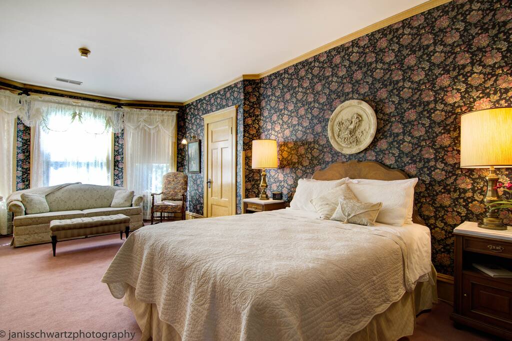 The Nebraska Room with its original bird's-eye faux painted woodwork with private bath.